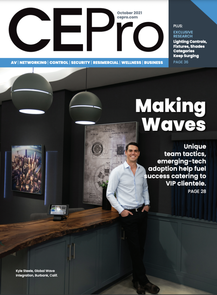 EPro magazine's cover features Global Wave Integration's president exuding elegance in a light blue shirt, black business pants, leaning against a hand-crafted wooden island in a blue-cabinet kitchen, with chandelier-style lights and a logo-adorned touch screen.