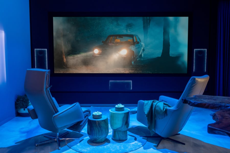 A movie theater showroom washed in blue light.