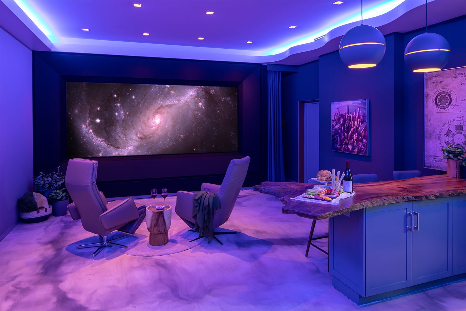 The Global Wave Showroom radiates in tranquil purple light, featuring a mesmerizing galaxy view on its theater screen, accompanied by opulent chairs and a carefully crafted wooden island adorned with delicious cuisine and wine.