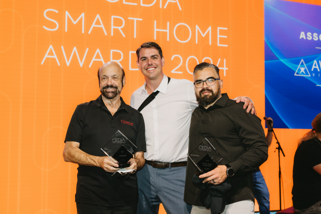 Global Wave Integration team smiles for CEDIA Smart Home Award picture.